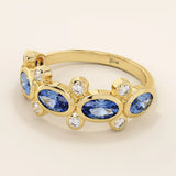 Bold gold ring with five bezel set oval sapphire gemstones. A striking statement ring with a unique symmetrical design.