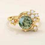 Chunky 14k gold ring with moss agate stone and celestial moon detail. Unique gemstone ring with natural patterns. Ideal for earthy and bold styles.