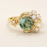 Chunky 14k gold ring with moss agate stone and celestial moon detail. Unique gemstone ring with natural patterns. Ideal for earthy and bold styles.