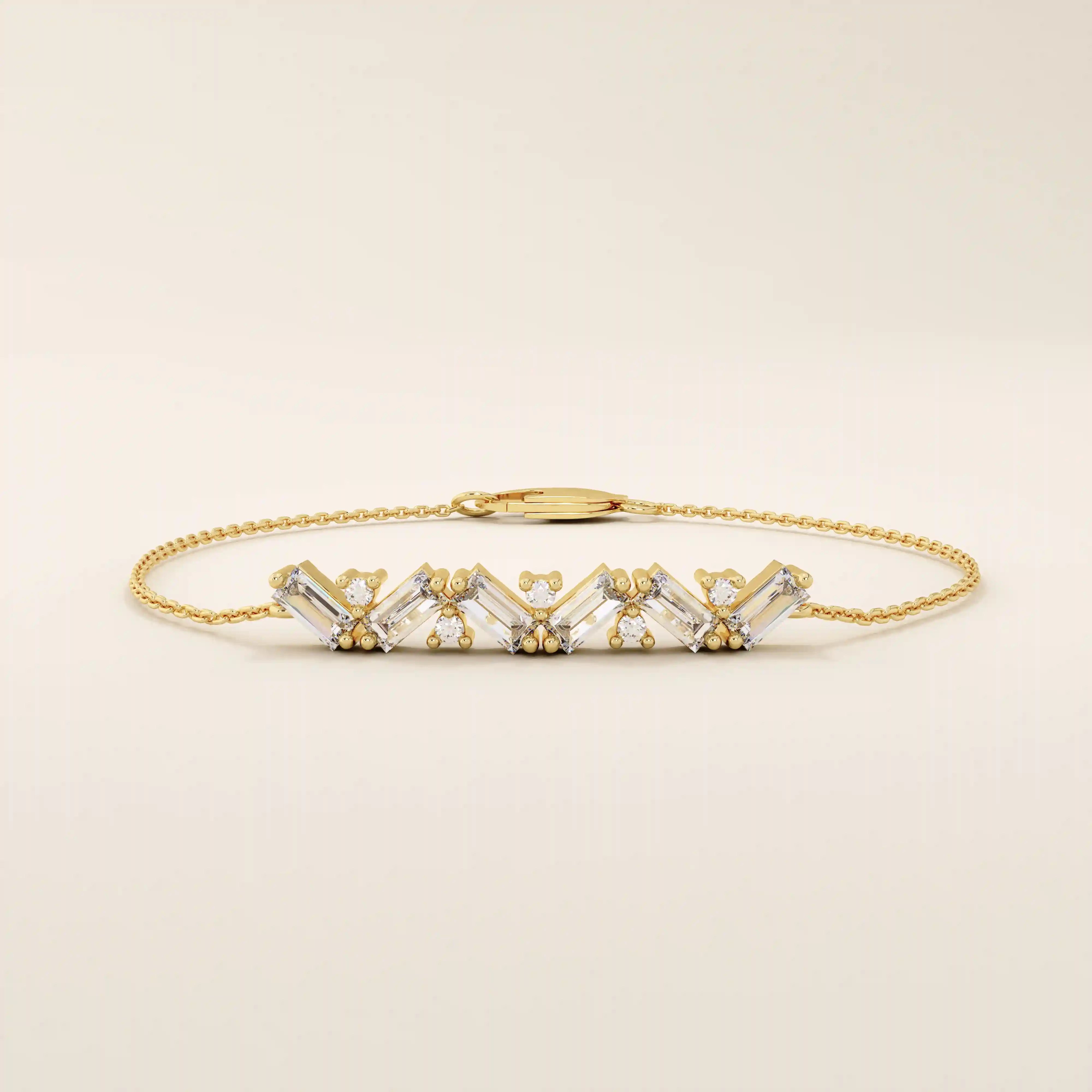 Close-up of a 14k yellow gold baguette bar bracelet highlighting the alternating baguette-cut stones and round stones.