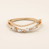 Curved beaded ring in 14k solid gold, featuring marquise and round moissanites. A unique nesting design perfect for stacking with solitaires.