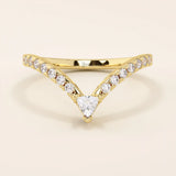 Curved stacking ring in 14k solid gold with a triangle moissanite at the peak and pavé moissanite accents. A modern, geometric nesting design.