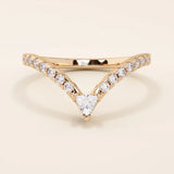 Curved stacking ring in 14k solid gold with a triangle moissanite at the peak and pavé moissanite accents. A modern, geometric nesting design.