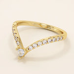 Curved stacking ring in 14k solid gold with a triangle moissanite at the peak and pavé moissanite accents. A modern, geometric nesting design.