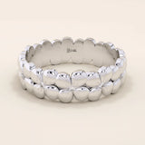 Daisy flower band ring in 14k solid gold, featuring tiny pavé moissanites. A thick yet delicate statement ring with floral charm.