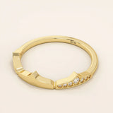 Distinctive 14k solid gold stacking ring with a unique design. A versatile piece perfect for mixing and matching in any ring stack.