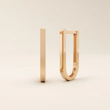 Elegant U-shape hoop earrings in 14k rose gold, featuring a polished contemporary design.