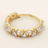 Gold wedding ring with triangle moissanite accents