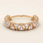 Gold wedding ring with triangle moissanite accents