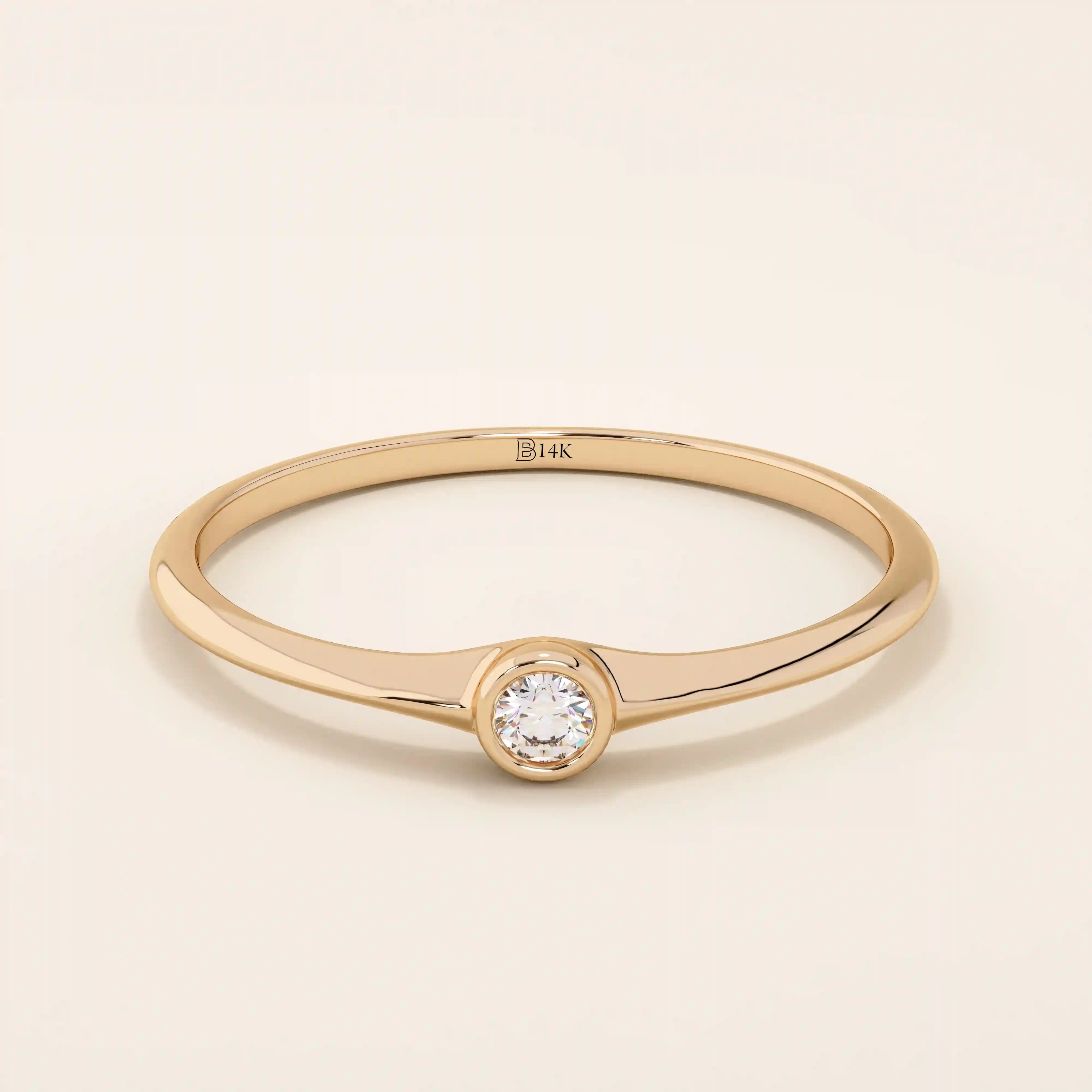 Minimalist 14k solid gold promise ring with a tiny bezel-set moissanite. Sleek and delicate design ideal for everyday wear.