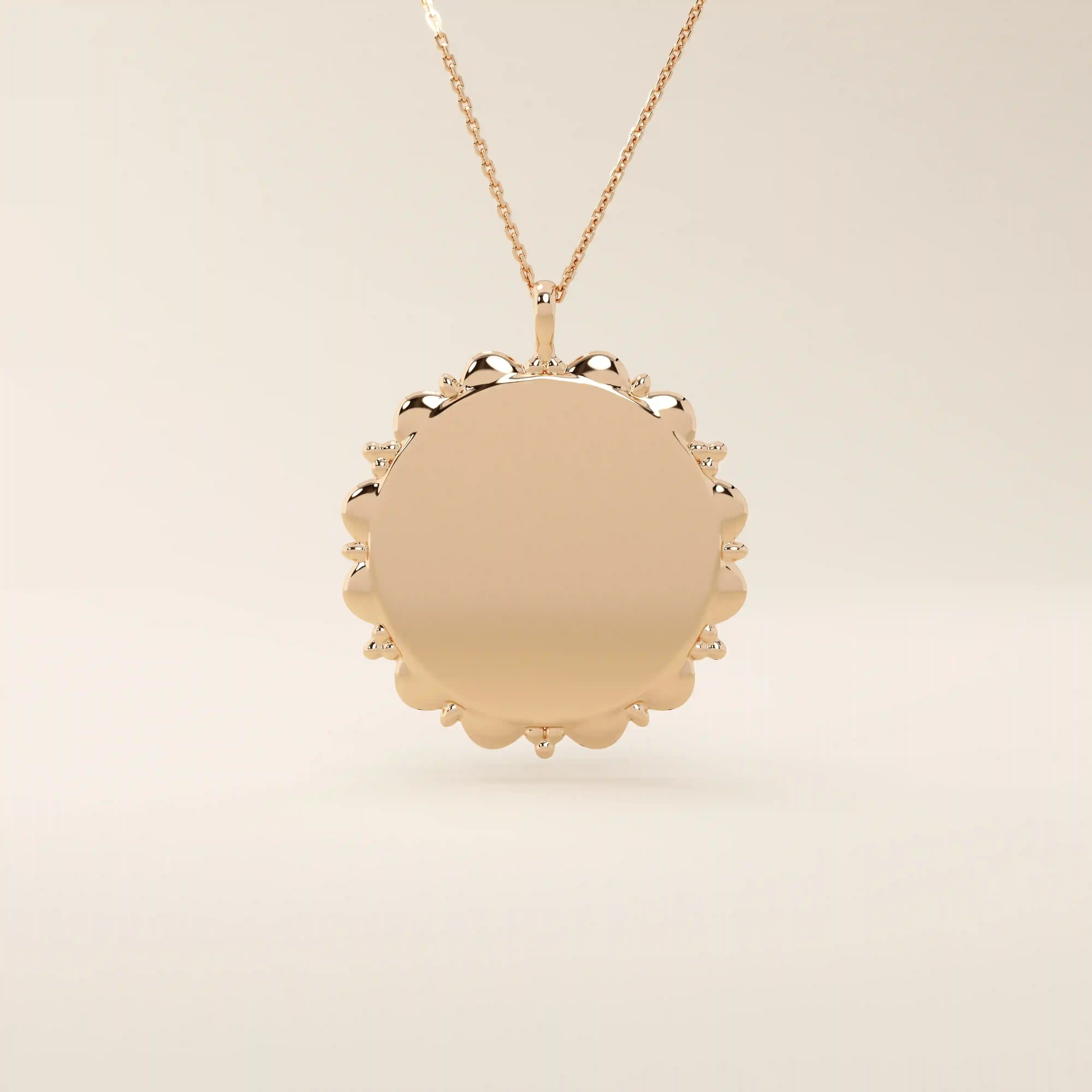 Minimalist sun-shaped necklace in 14k solid gold with a smooth, engravable surface. A timeless everyday piece perfect for personalization and gifting.
