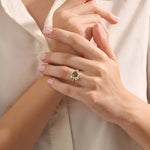 Model wearing a bold moss agate gold ring with celestial moon design. Nature-inspired statement ring with organic charm in solid gold.