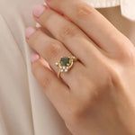 Model wearing a bold moss agate gold ring with celestial moon design. Nature-inspired statement ring with organic charm in solid gold.