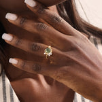Model wearing a bold moss agate gold ring with celestial moon design. Nature-inspired statement ring with organic charm in solid gold.