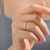 Model wears a 14k gold cluster moissanite wedding band promise ring. A stunning and timeless piece perfect for daily wear or special occasions.