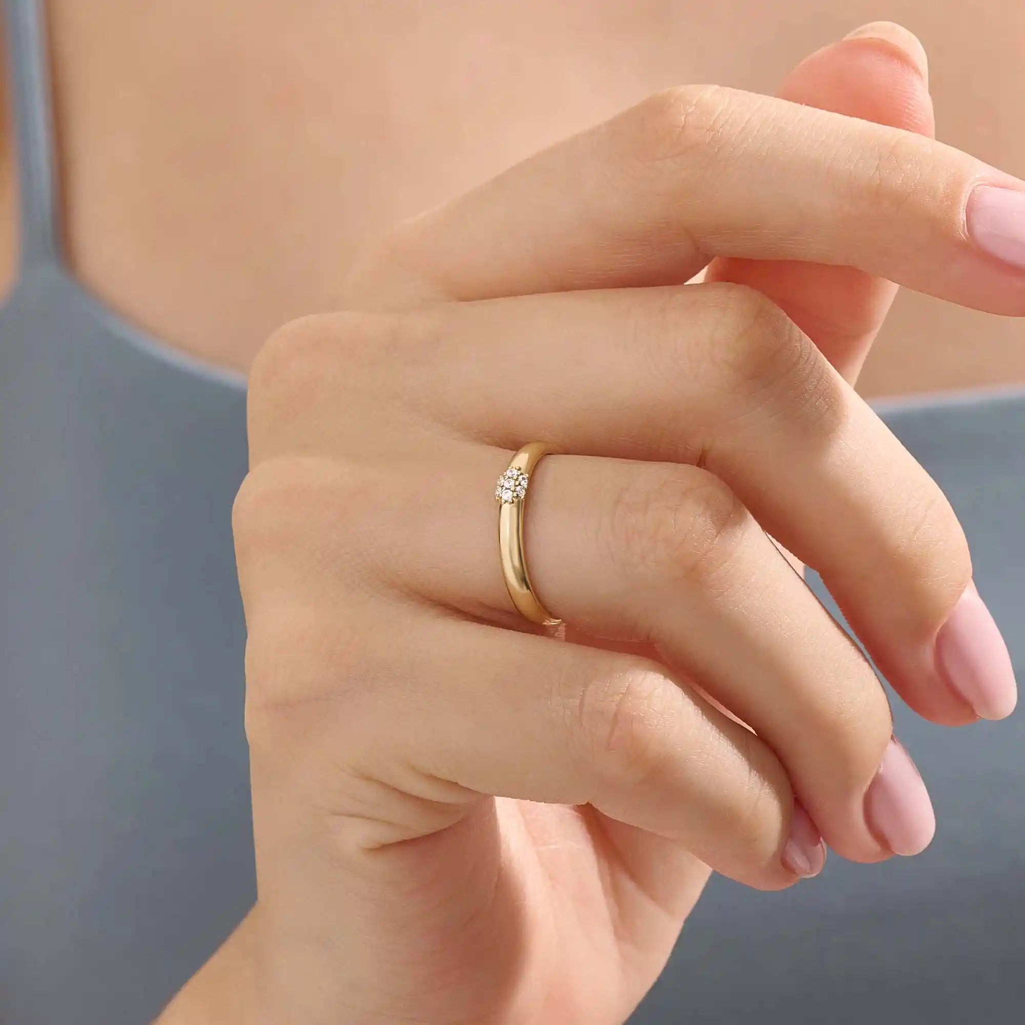Model wears a 14k gold cluster moissanite wedding band promise ring. A stunning and timeless piece perfect for daily wear or special occasions.