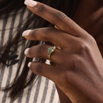 Model wears a 14k solid gold chunky ring featuring a natural moss agate gemstone. Bold and organic anniversary style.