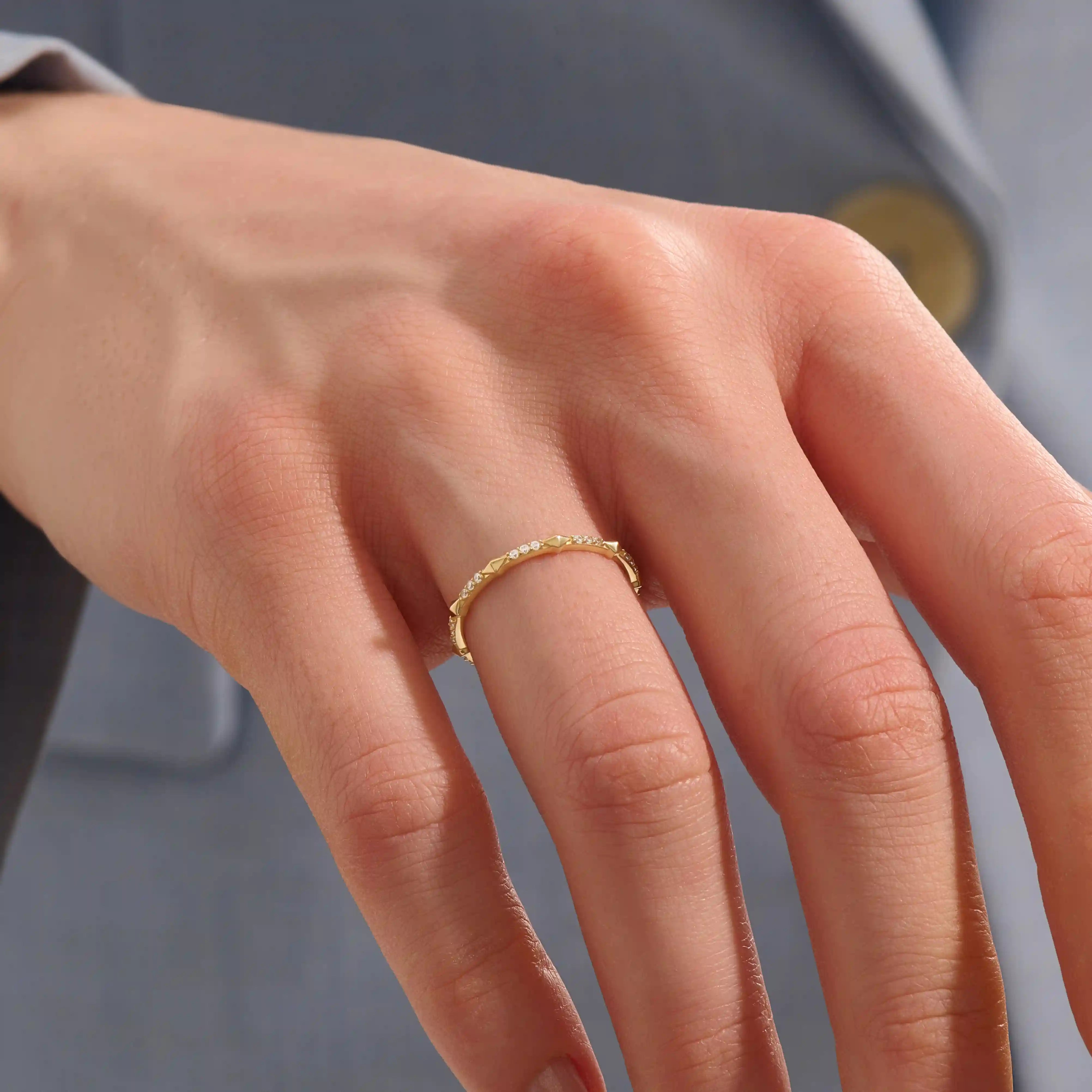 Model wears a 14k solid gold ultra-slim eternity spike stacking ring. Perfect for minimalist stacking and daily style.