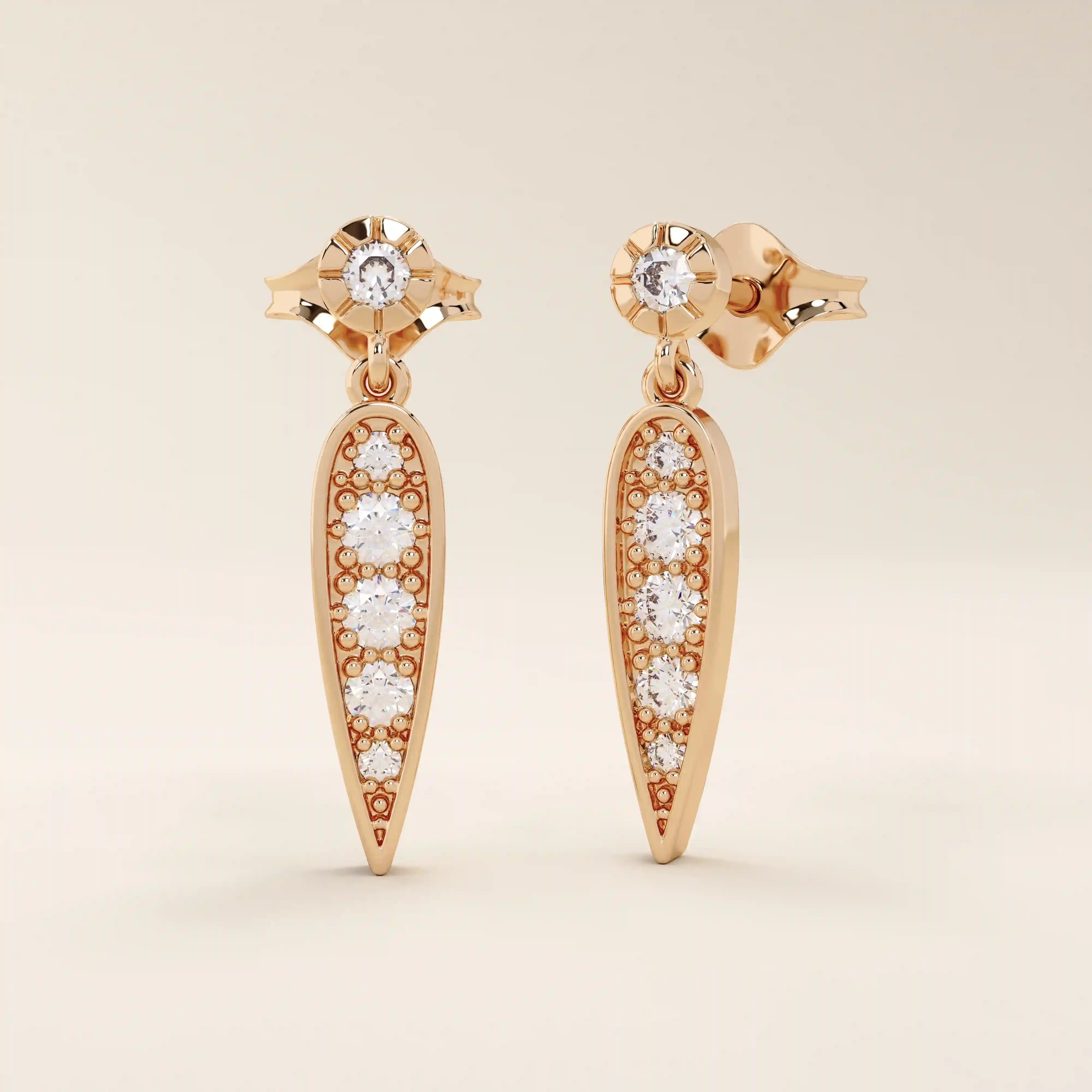 Nature-inspired dangling leaf stud earrings in 14k solid gold. Delicate and lightweight design perfect for everyday elegance.