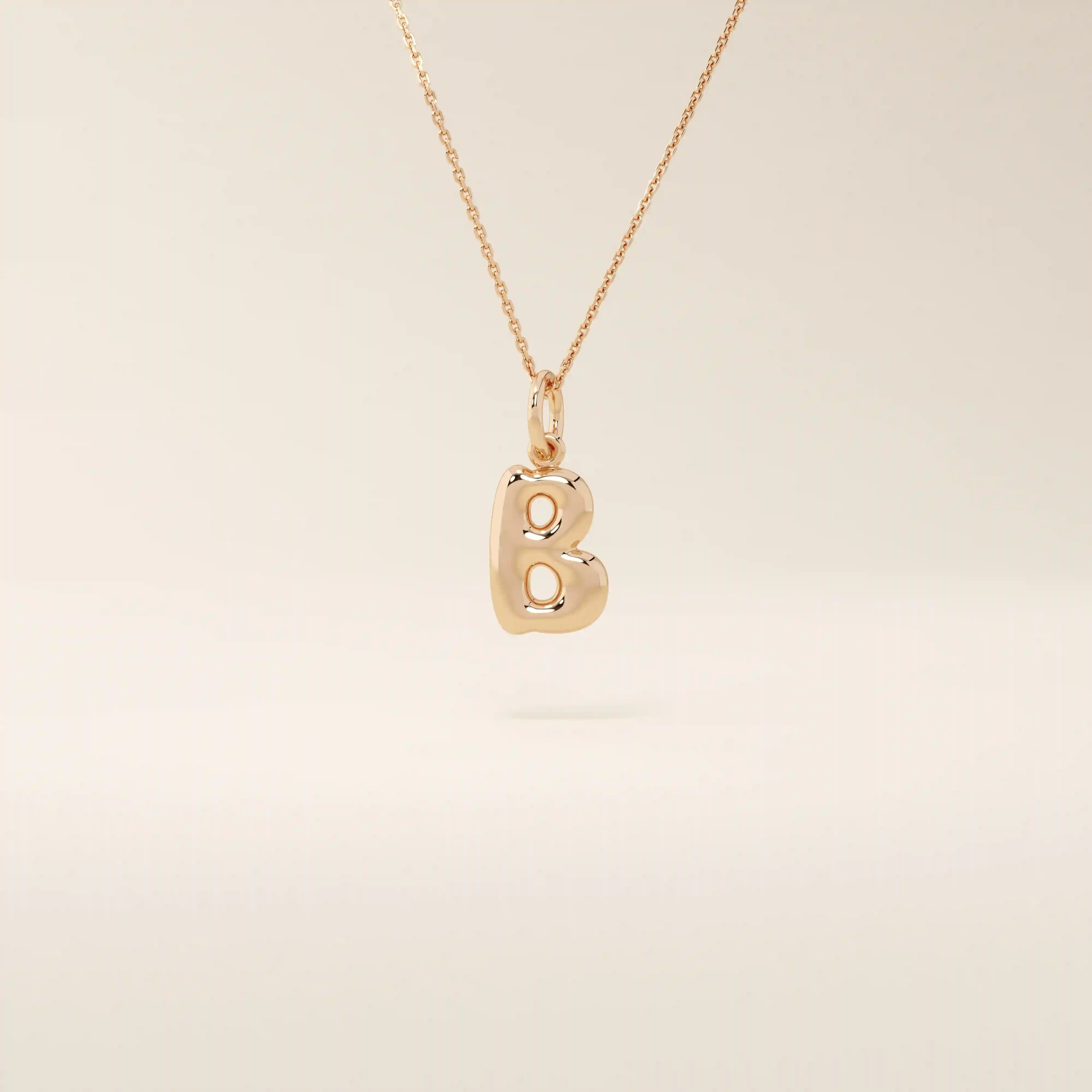 Puffy initial letter necklace crafted in 14k solid gold with a soft, dimensional finish. A modern personalized piece ideal for everyday layering.