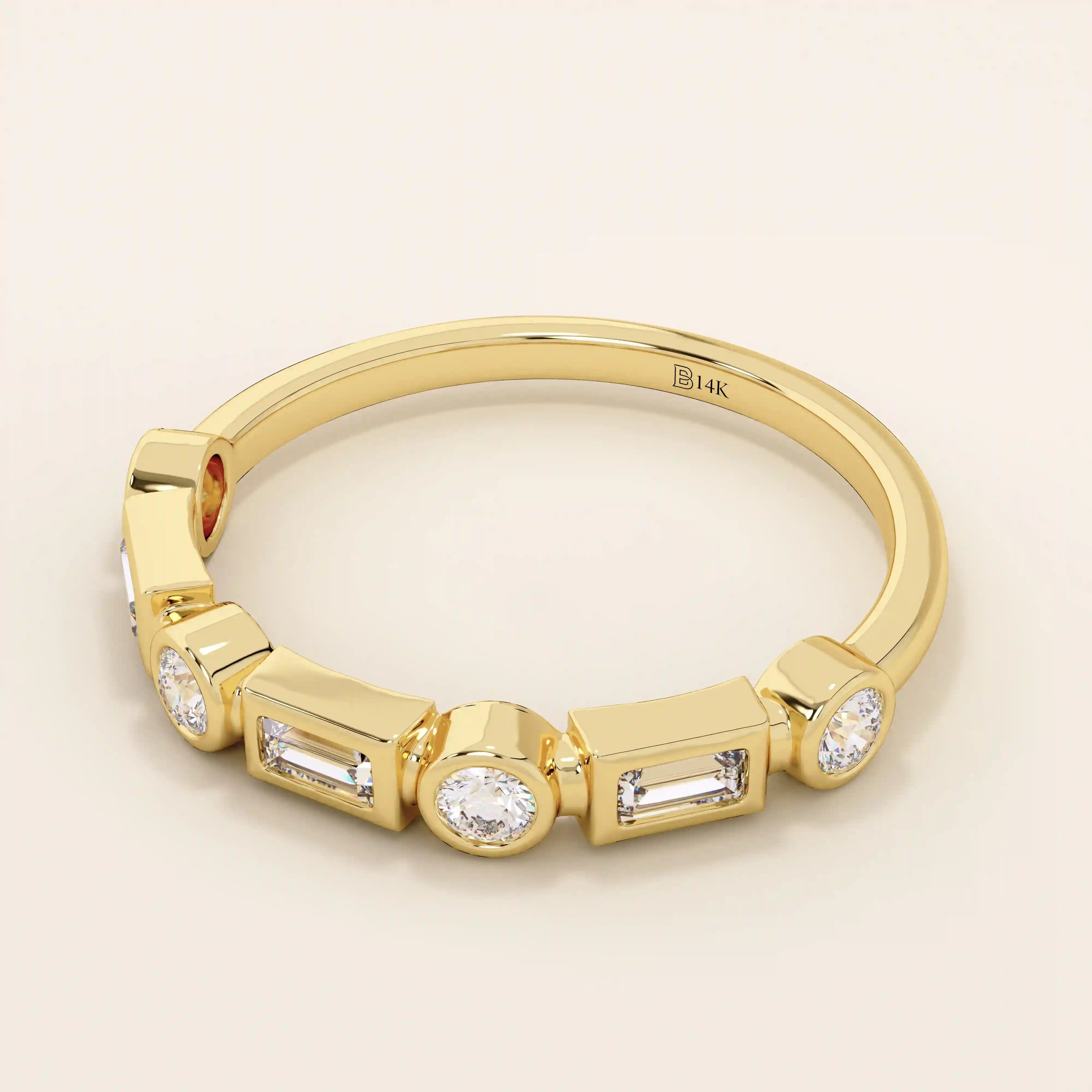 Side angle view of a 14k solid yellow gold band with alternating baguette cut and round brilliant cut moissanite stones in a modern bezel setting, stylish and refined bridal jewelry
