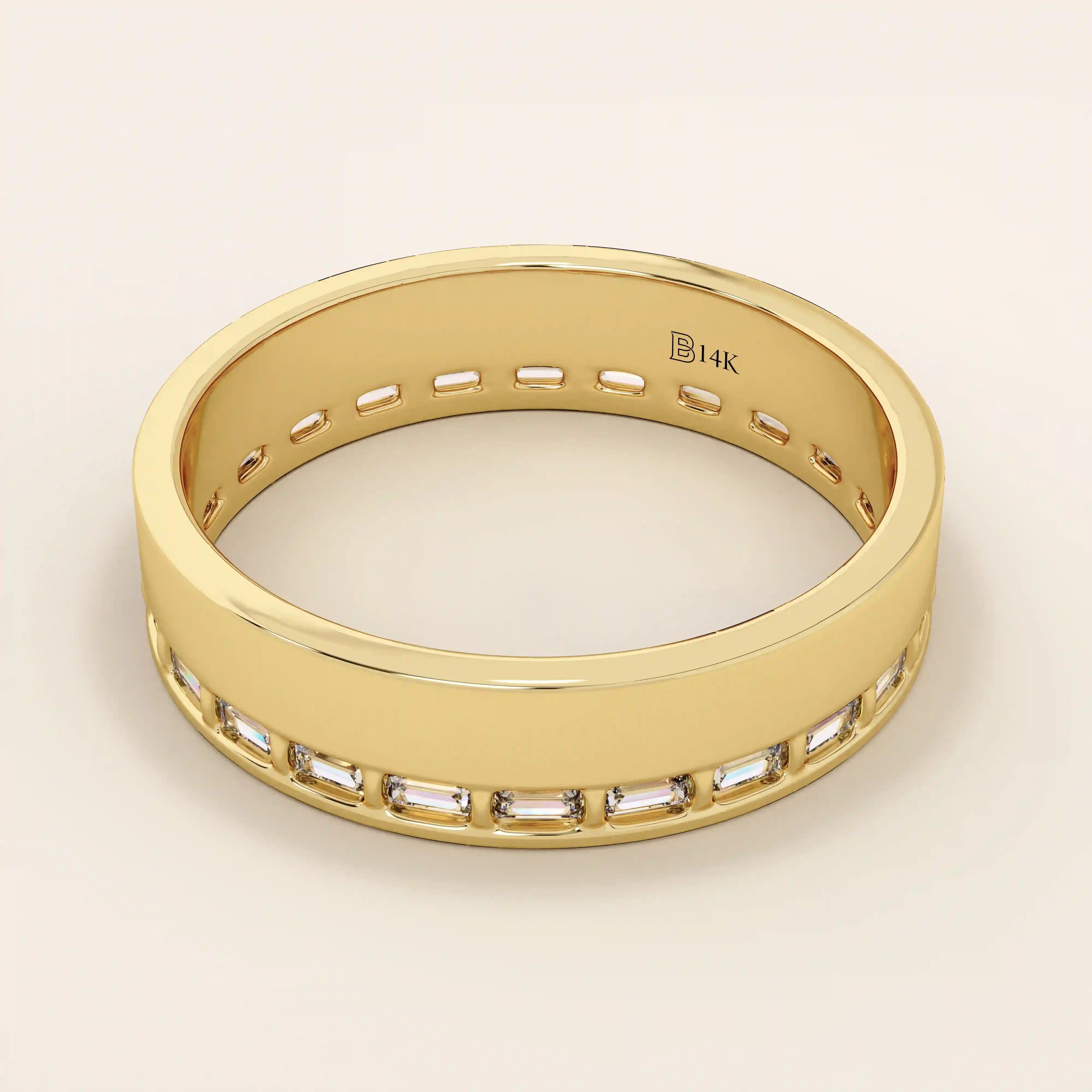 Side angle view of a 14k solid yellow gold wedding band with baguette-cut moissanite stones in a continuous channel setting