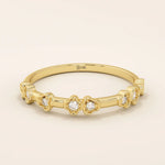 Slim 14k solid gold stacking ring with tiny flower motifs, minimalist and feminine jewelry design for everyday wear.