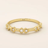 Slim 14k solid gold stacking ring with tiny flower motifs, minimalist and feminine jewelry design for everyday wear.