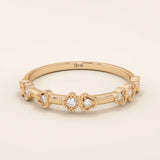 Slim 14k solid gold stacking ring with tiny flower motifs, minimalist and feminine jewelry design for everyday wear.