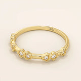 Slim 14k solid gold stacking ring with tiny flower motifs, minimalist and feminine jewelry design for everyday wear.