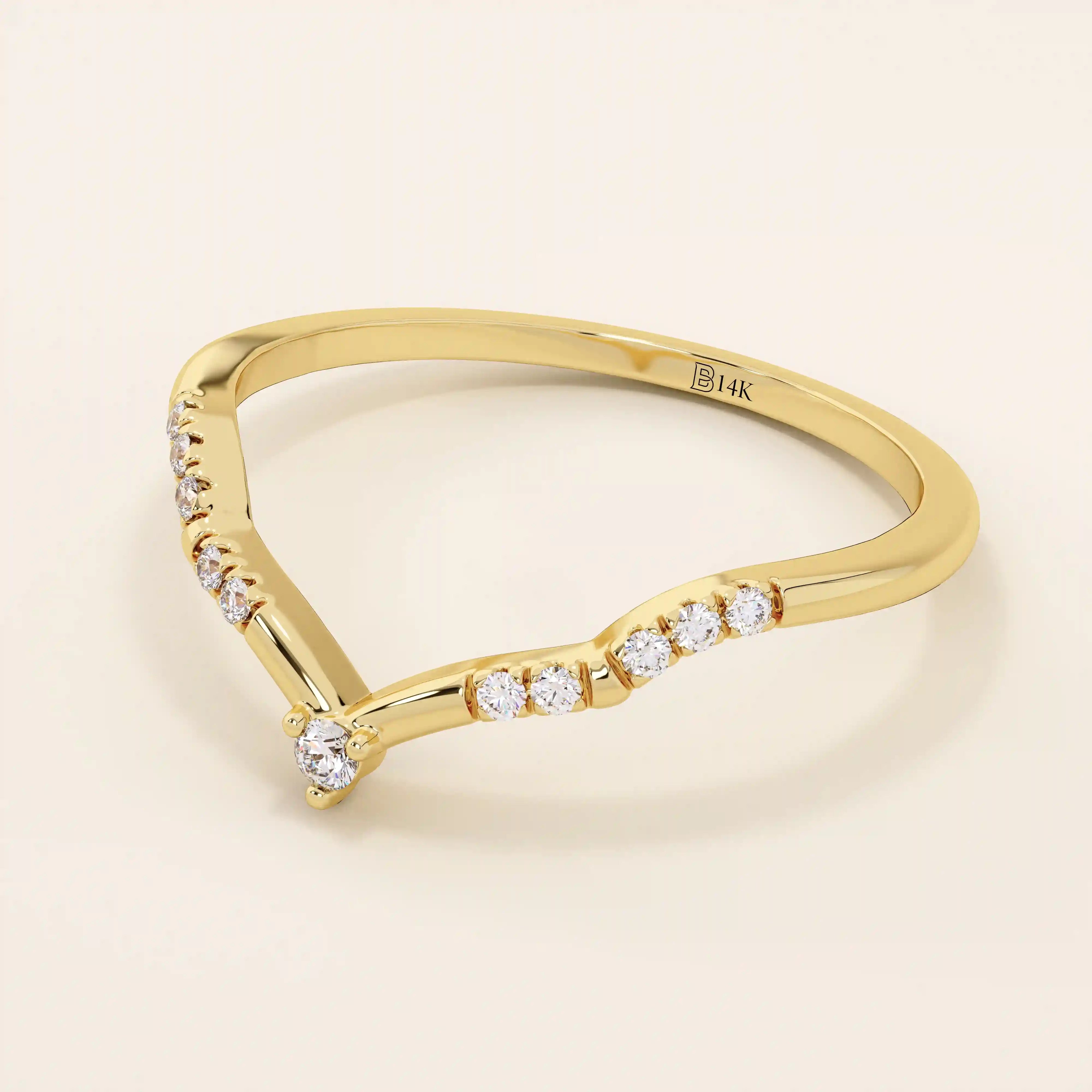 Slim chevron-shaped curve ring in 14k solid gold, accented with pavé moissanites. A delicate nesting band with modern lines and sparkle.