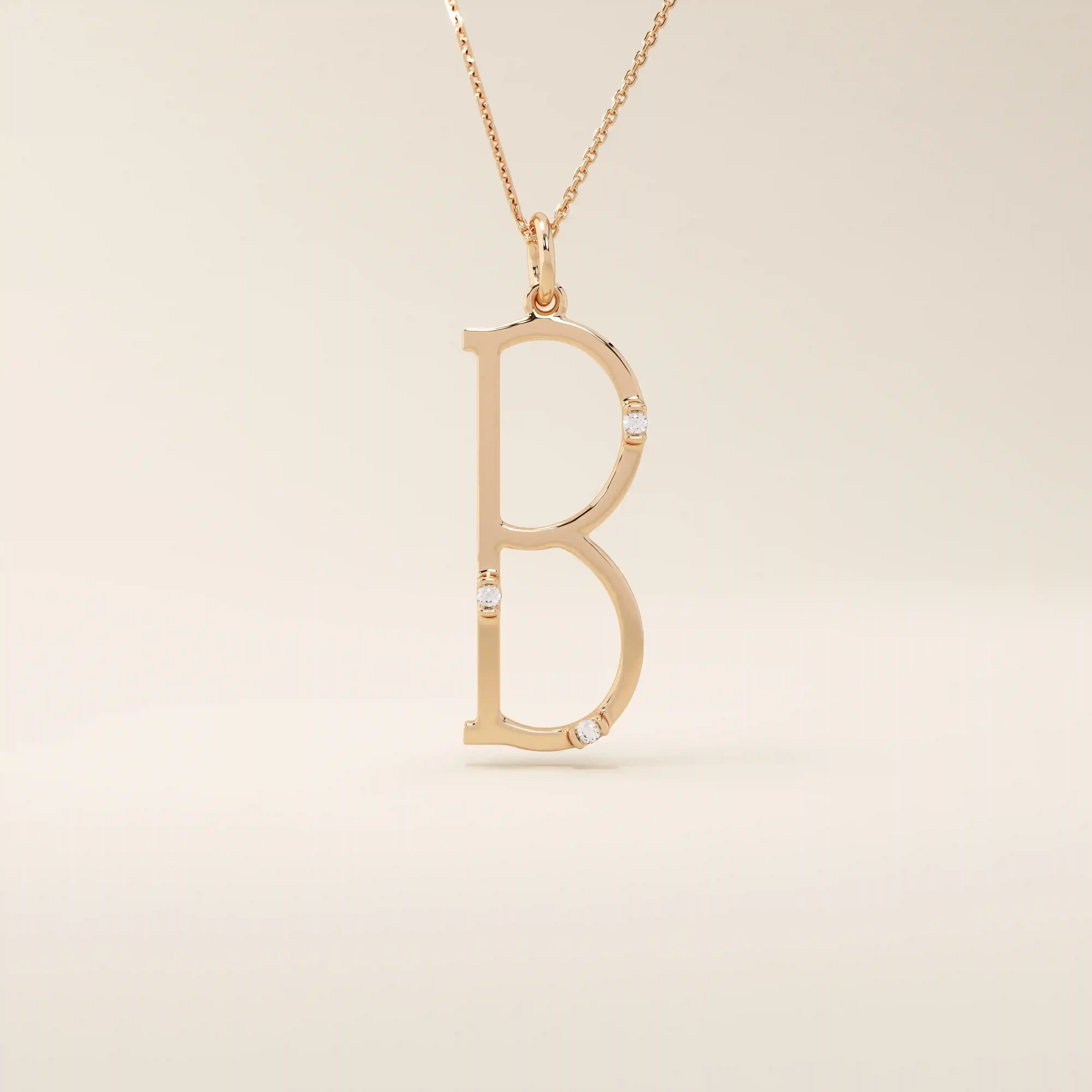 Slim initial letter necklace in 14k solid gold, accented with tiny moissanites for subtle sparkle. A sleek and personal everyday accessory.