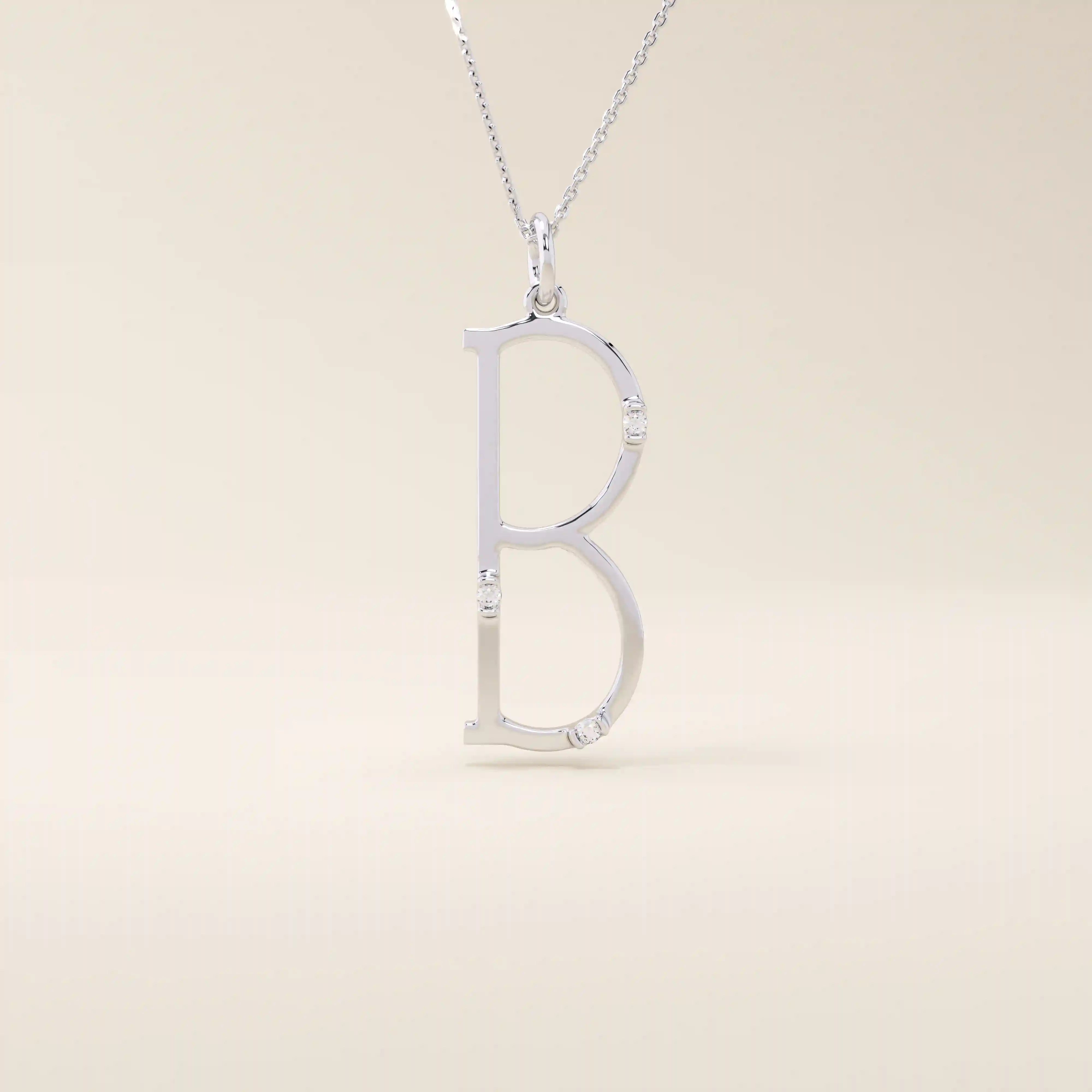 Slim initial letter necklace in 14k solid gold, accented with tiny moissanites for subtle sparkle. A sleek and personal everyday accessory.