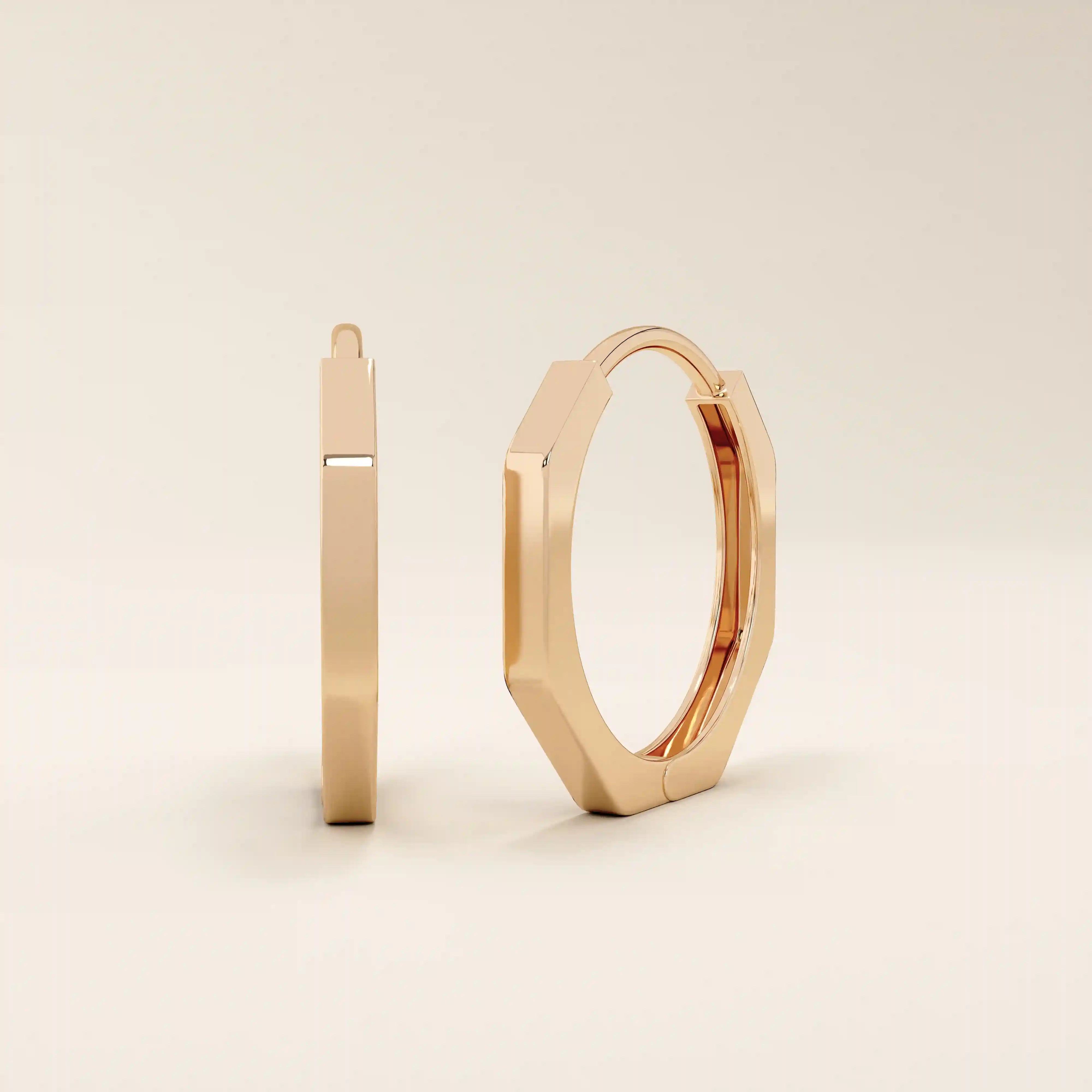 Small minimal hoop earrings in 14k rose gold, featuring a clean and contemporary design.