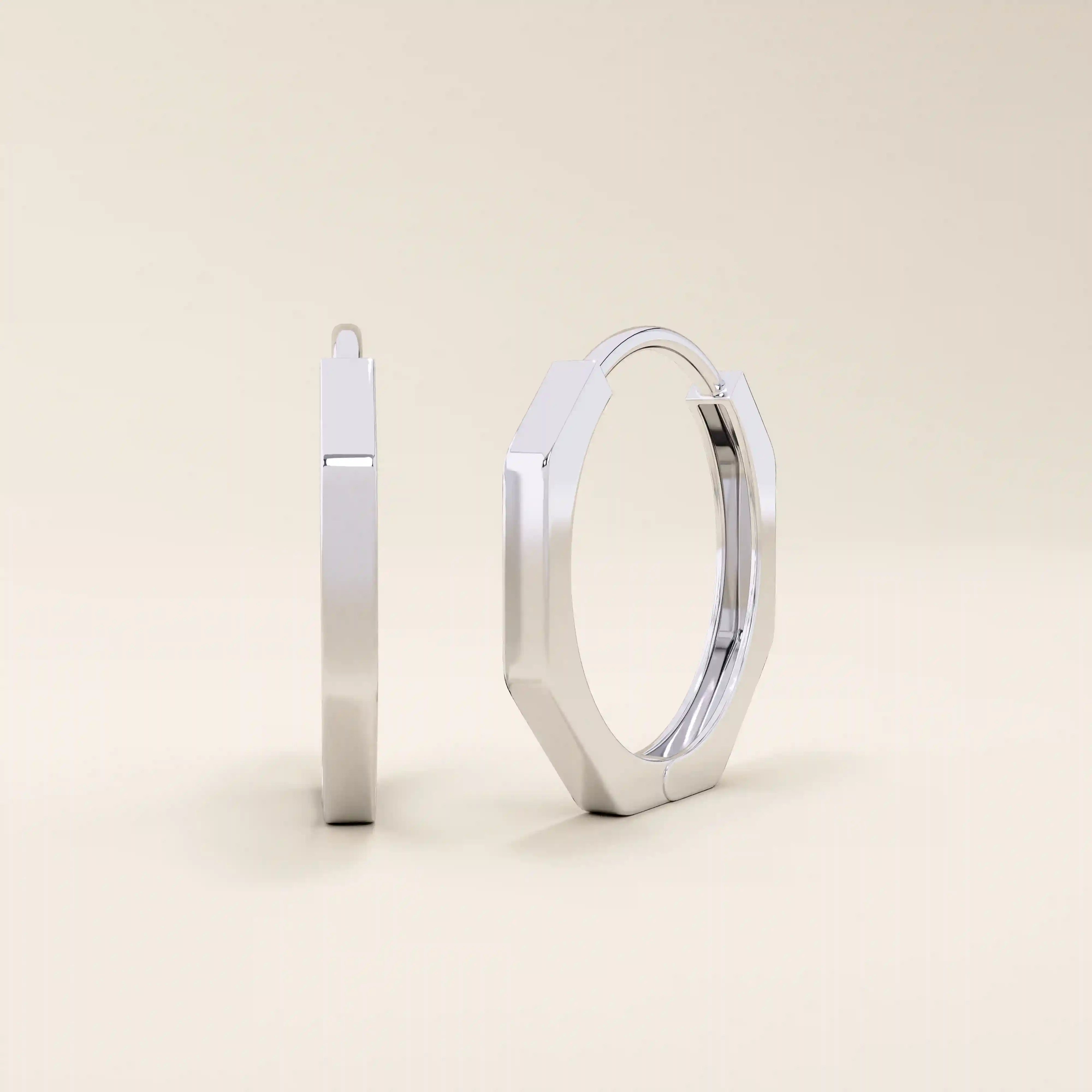 Small minimal hoop earrings in 14k white gold, crafted in a modern geometric shape.