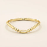 Ultra slim curved nesting ring in 14k solid gold, designed for a seamless fit around engagement rings. Minimalist and lightweight for everyday wear.