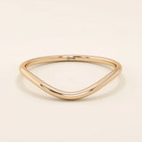 Ultra slim curved nesting ring in 14k solid gold, designed for a seamless fit around engagement rings. Minimalist and lightweight for everyday wear.