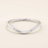 Ultra slim curved nesting ring in 14k solid gold, designed for a seamless fit around engagement rings. Minimalist and lightweight for everyday wear.