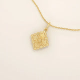 Unique 14k solid gold clover motif necklace featuring a smooth, plain pendant in a four-leaf design, symbolizing luck and elegance, perfect for everyday wear.