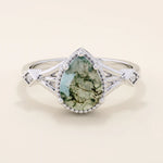 Vintage-inspired 14k gold ring featuring a pear cut natural moss agate. Unique gemstone anniversary ring with organic patterns.