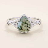 Vintage-inspired 14k gold ring featuring a pear cut natural moss agate. Unique gemstone anniversary ring with organic patterns.