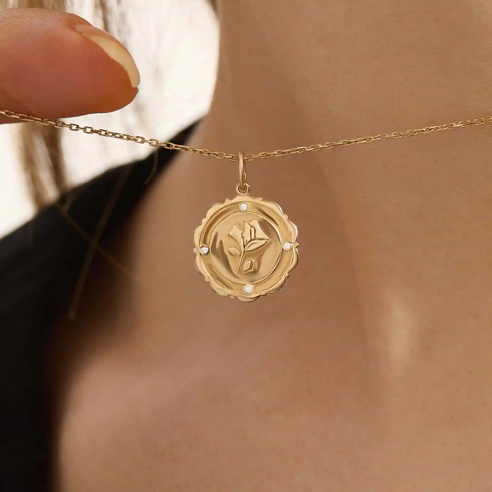 Woman wearing a 14k solid gold rose pendant necklace with delicate moissanite details. Floral-inspired minimalist jewelry styled for everyday. A timeless gold necklace for women.