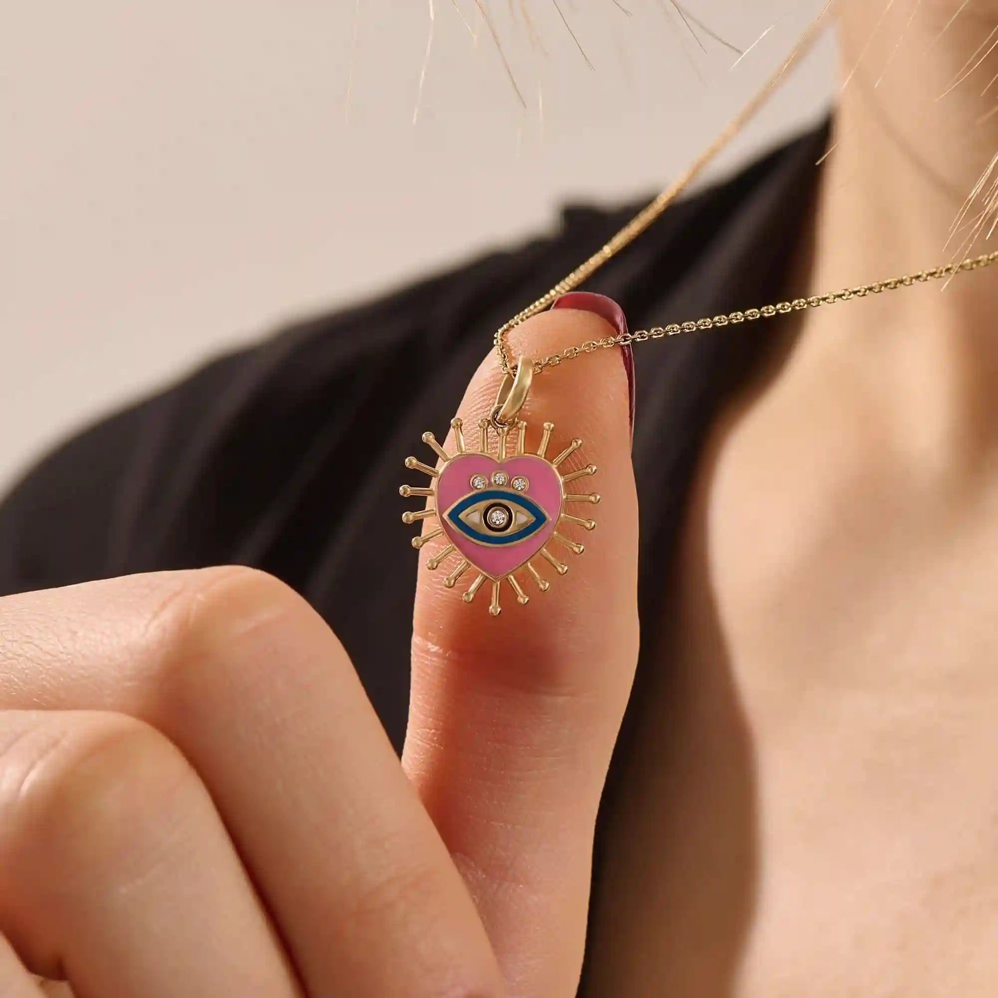 14K solid gold necklace features a beautifully detailed pink and blue enamel evil eye heart pendant
