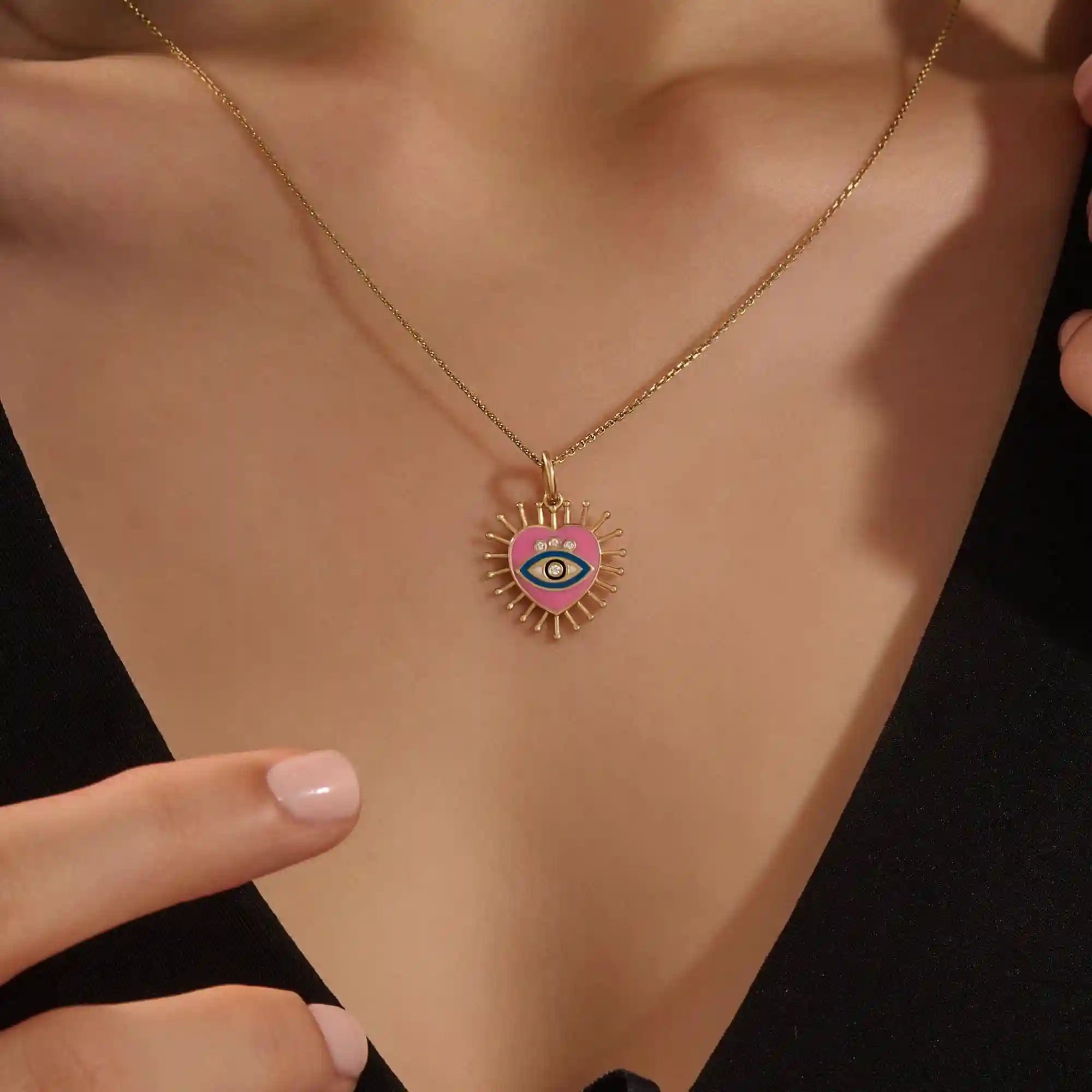 14K solid gold necklace features a beautifully detailed pink and blue enamel evil eye heart pendant