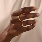 14k solid gold  geometric textured patterned slim unisex wedding band alliance with bezel set princess cut moissanite