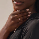 stacking wedding ring with a sparkling lab-grown ruby birthstone with moissanite stones each securely set in a bezel in 14k solid gold for women