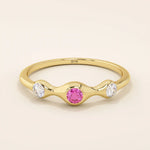 stacking wedding ring with a sparkling lab-grown ruby birthstone with moissanite stones each securely set in a bezel in 14k solid gold for women