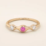 stacking wedding ring with a sparkling lab-grown ruby birthstone with moissanite stones each securely set in a bezel in 14k solid gold for women