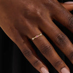 stacking wedding ring with a sparkling lab-grown ruby birthstone with moissanite stones each securely set in a bezel in 14k solid gold for women