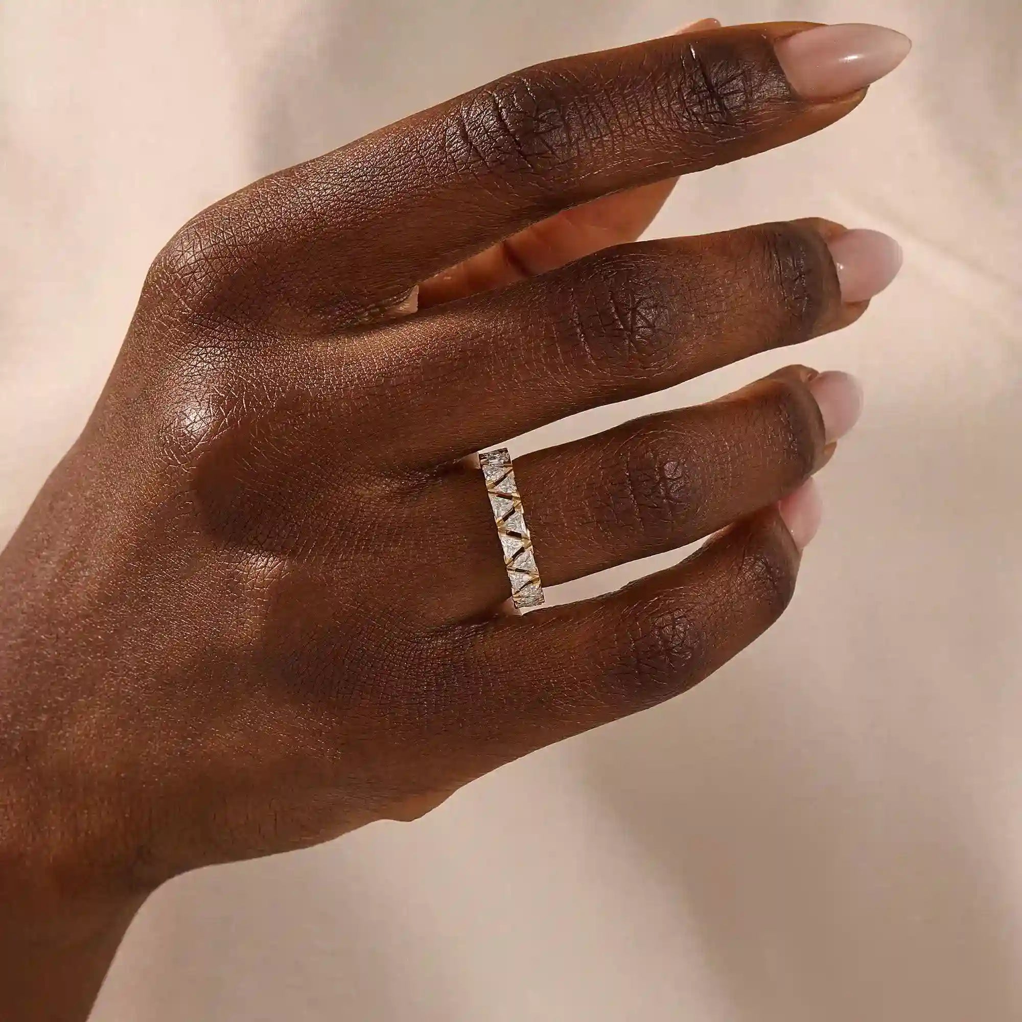 Gold ring with triangle moissanite accents